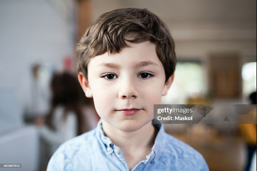 Close-up portrait of boy standing in classroom