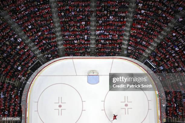 Alex Ovechkin of the Washington Capitals skates alone on the ice during a stop in play during the first period against the Pittsburgh Penguins in...