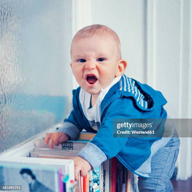 little boy making a funny face - angry boy stock pictures, royalty-free photos & images