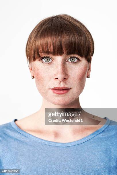 biometric passport photo of a green-eyed read-haired woman with freckles and bangs - portraits of people passport stock pictures, royalty-free photos & images