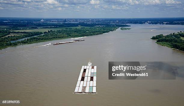 usa, tennessee, aerial photograph of tug and barges heading up the mississippi river near memphis - tug barge stock pictures, royalty-free photos & images