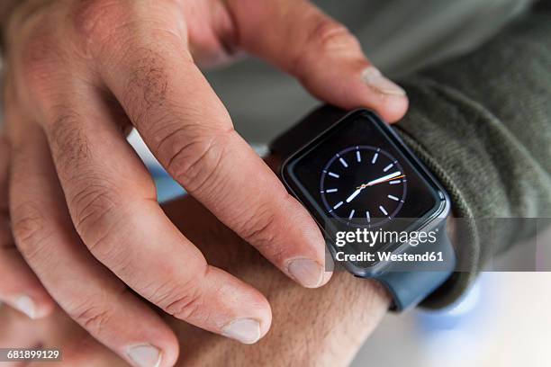 businessman with smartwatch, close-up - wristwatch imagens e fotografias de stock