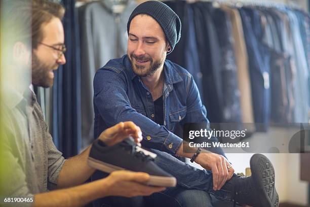 man shopping for shoes - footwear retail stock pictures, royalty-free photos & images