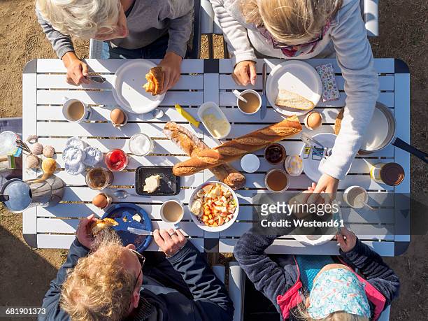 family sitting on table, breakfast - high angle view family stock pictures, royalty-free photos & images