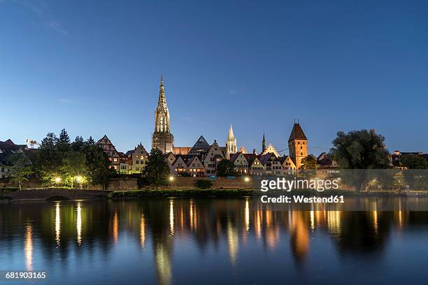 germany, ulm, view to the city with danube river in the foreground at dusk - ulm stock pictures, royalty-free photos & images