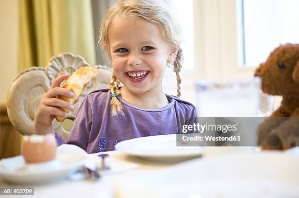 portrait of happy blond girl at breakfast table - kid boiled egg stock pictures, royalty-free photos & images