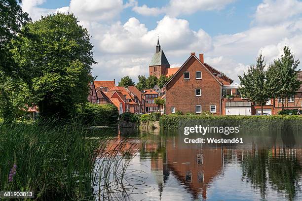 germany, moelln, view to the city with st. nicolai and wallgraben in the foreground - mölln imagens e fotografias de stock