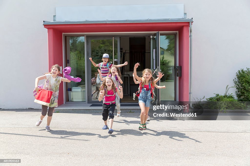 Happy pupils leaving school