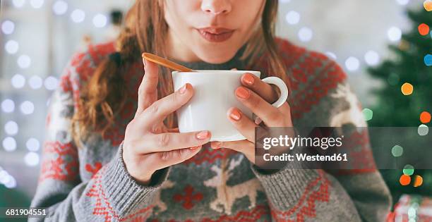 woman with cup of coffee at christmas time, close-up - christmas coffee imagens e fotografias de stock