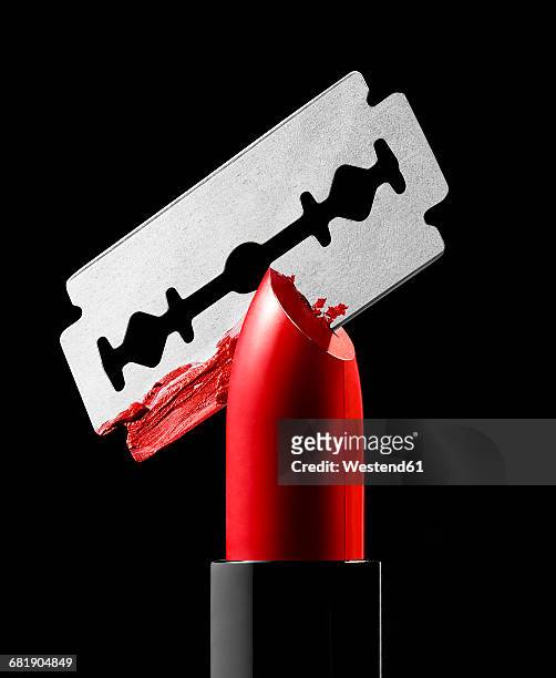 razor blade cutting through red lipstick - lipstick smudge imagens e fotografias de stock