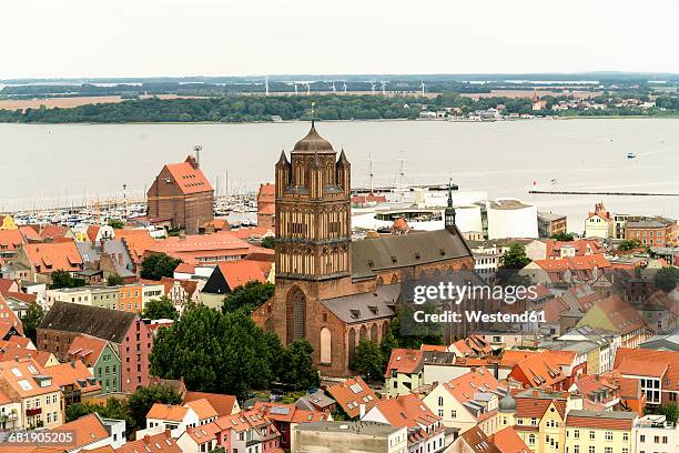 germany, stralsund, view to st. james' church at the historic old town and ruegen island - stralsund stock pictures, royalty-free photos & images