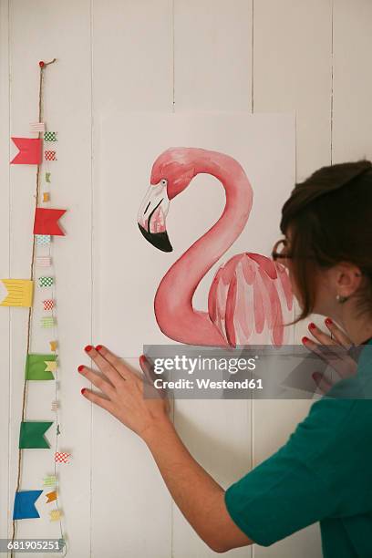 artist watching her aquarelle of a flamingo - artists with animals ストックフォトと画像