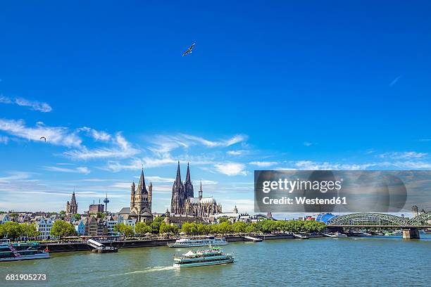 germany, cologne, view to the skyline with rhine river in the foreground - rhein stock-fotos und bilder