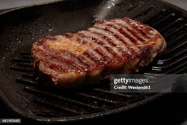 fried beef steak in pan - entrecôte stock pictures, royalty-free photos & images