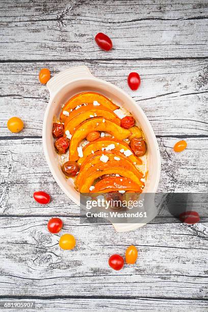 pumpkin gratin with tomato and feta cheese - hokaido pumpkin stock pictures, royalty-free photos & images