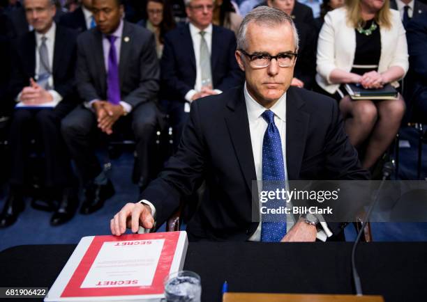 Acting FBI Director Andrew McCabe prepares to testify during the Senate Intelligence Committee hearing on "World Wide Threats" on Thursday, May 11,...