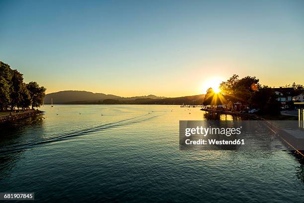 austria, seewalchen am attersee, evening sun above lake attersee - attersee stock pictures, royalty-free photos & images