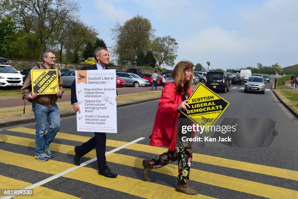 Scottish Liberal Democrat leader Willie Rennie does a Beatles Abbey Road-style pose as he launches a general election "Commit Card" to be sent to...