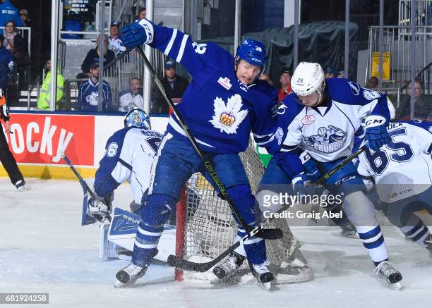 Colin Greening of the Toronto Marlies battles with Ben Thomas of the Syracuse Crunch during game 3 action in the Division Final of the Calder Cup...