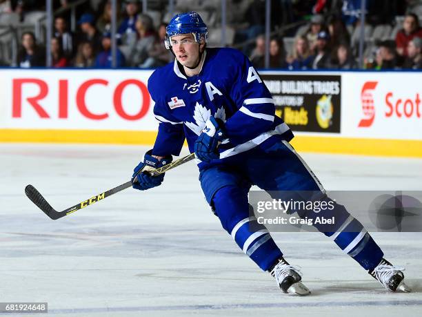 Justin Holl of the Toronto Marlies turns up ice against the Syracuse Crunch during game 3 action in the Division Final of the Calder Cup Playoffs on...