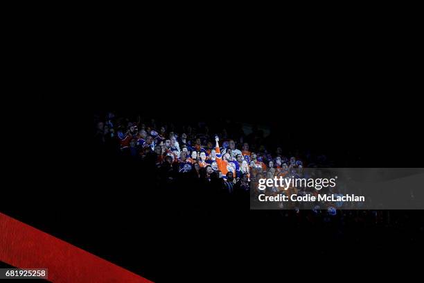 Anthem singer Robert Clark leads the audience in the singing of the Canadian and United States' national anthems as the Edmonton Oilers take on the...