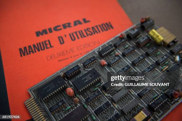 The microprocessor's card of the first microcomputer named "Micral N", is shown by the auctioneer on May 11, 2017 in Tours, ahead of an auction next...