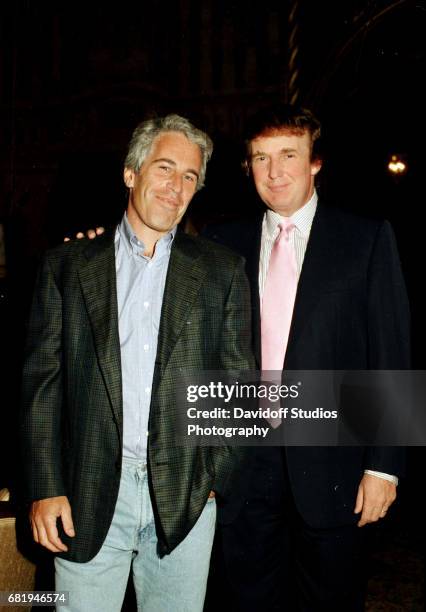 Portrait of American financier Jeffrey Epstein and real estate developer Donald Trump as they pose together at the Mar-a-Lago estate, Palm Beach,...