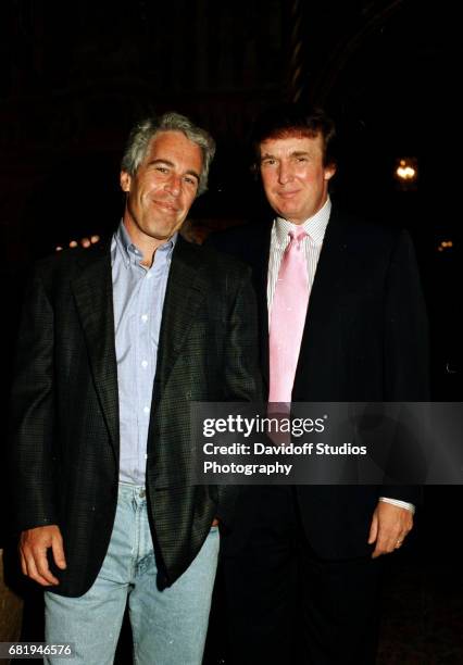 Portrait of American financier Jeffrey Epstein and real estate developer Donald Trump as they pose together at the Mar-a-Lago estate, Palm Beach,...