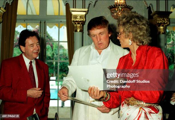 View of, from left, American film producer James Grau, his brother-in-law, real estate developer Donald Trump, and former competative swimmer...