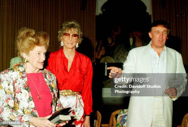 American former competative swimmer Marjorie Post Dye stands with Mary Trump and the latter's son, real estate developer Donald Trump, during an...