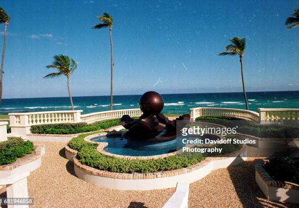 View of a fountain sculpture on an ocean-front patio on the grounds of the Maison de l'Amitie estate, Palm Beach, Florida, January 30, 1990. The...