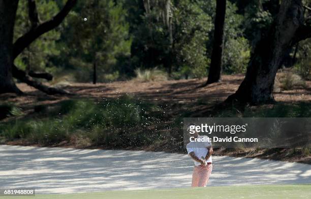 Yuta Ikeda of Japan plays his third shot on the par 4, 14th hole during the first round of THE PLAYERS Championship on the Stadium Course at TPC...