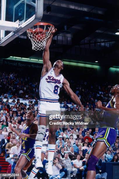 Eddie Johnson of the Sacramento Kings dunks against the Utah Jazz during a game played circa 1987 at Arco Arena in Sacramento, California. NOTE TO...