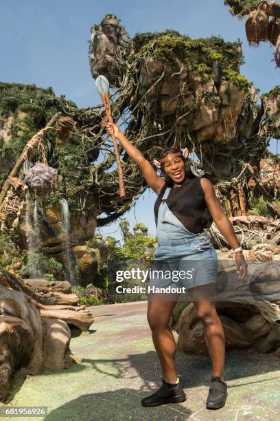 In this handout photo provided by Disney Parks, Tennis superstar Serena Williams channels her inner Na'vi during a sneak peek at Pandora - The World...