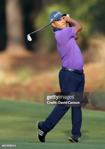 Fabian Gomez of Argentina plays his second shot on the par 4, 14th hole during the first round of THE PLAYERS Championship on the Stadium Course at...