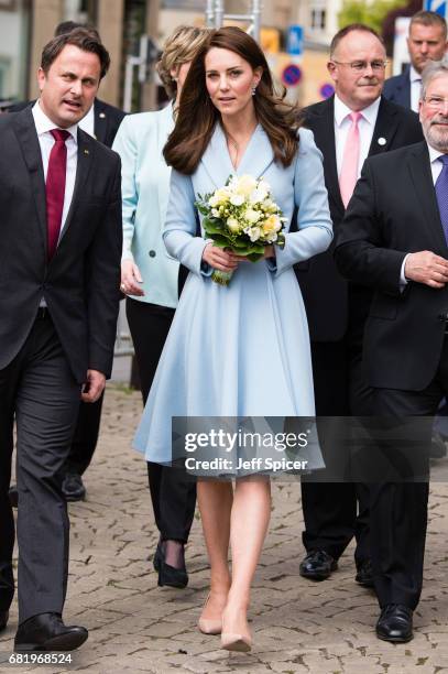 Catherine, Duchess of Cambridge escorted by Xavier Bettel, Prime Minister of Luxembourg , tours a cycling themed festival and unveils a mural of...