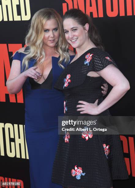 Actress Amy Schumer and sister/Producer/writer Kim Caramele arrive for the Premiere Of 20th Century Fox's "Snatched" held at Regency Village Theatre...