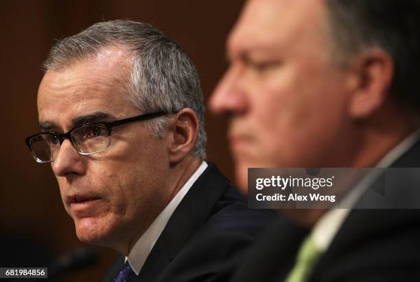 Cting FBI Director Andrew McCabe and Central Intelligence Agency Director Mike Pompeo testify before the Senate Intelligence Committee with the other...