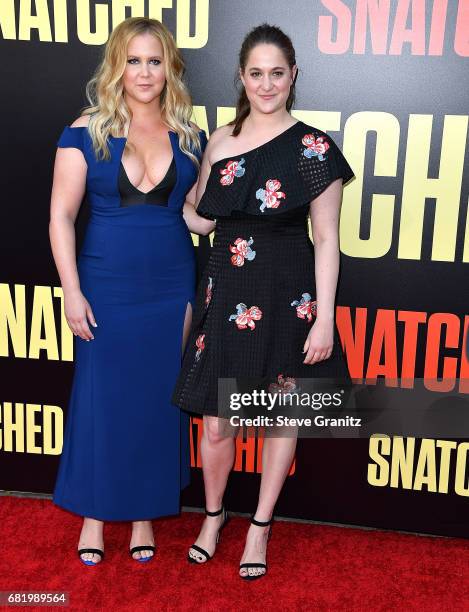 Amy Schumer, Kim Caramele arrives at the Premiere Of 20th Century Fox's "Snatched" at Regency Village Theatre on May 10, 2017 in Westwood, California.