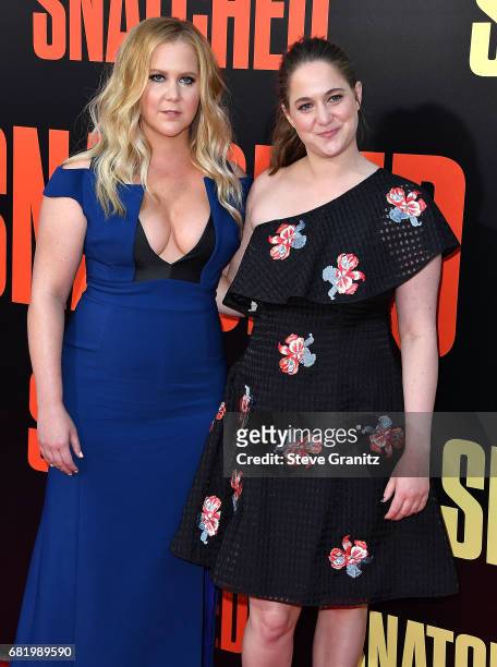 Amy Schumer, Kim Caramele arrives at the Premiere Of 20th Century Fox's "Snatched" at Regency Village Theatre on May 10, 2017 in Westwood, California.