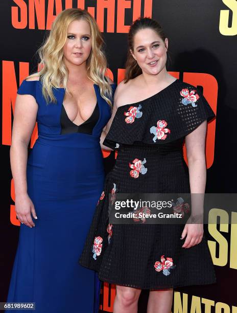 Amy Schumer, Kim Caramele arrives at the Premiere Of 20th Century Fox's "Snatched" at Regency Village Theatre on May 10, 2017 in Westwood, California.