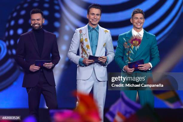 Hosts Timur Miroshnychenko, Oleksandr Skichko and Volodymur Ostapchuk speak on stage during the second semi final of the 62nd Eurovision Song Contest...