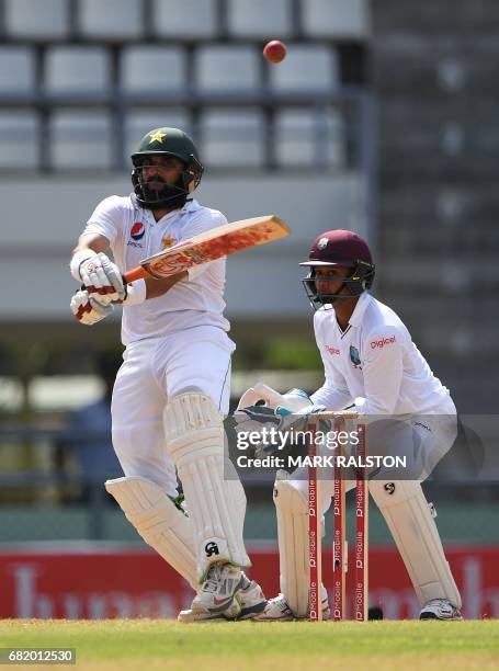 Captain Misbah-ul-Haq of Pakistan plays a shot before getting out for 59 off the bowling of Chase during his final test match, on the second day of...