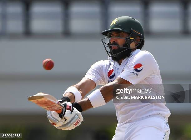 Captain Misbah-ul-Haq of Pakistan plays a shot before getting out for 59 off the bowling of Chase during his final test match, on the second day of...