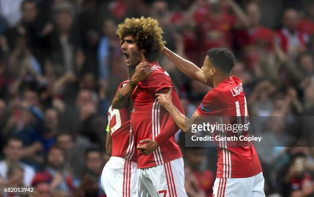 Marouane Fellaini of Manchester United celebrates scoring his sides first goal with team mates during the UEFA Europa League, semi final second leg...