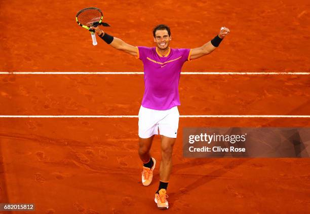 Rafael Nadal of Spain celebrates beating Nick Kyrgios of Australia on day six of the Mutua Madrid Open tennis at La Caja Magica on May 11, 2017 in...