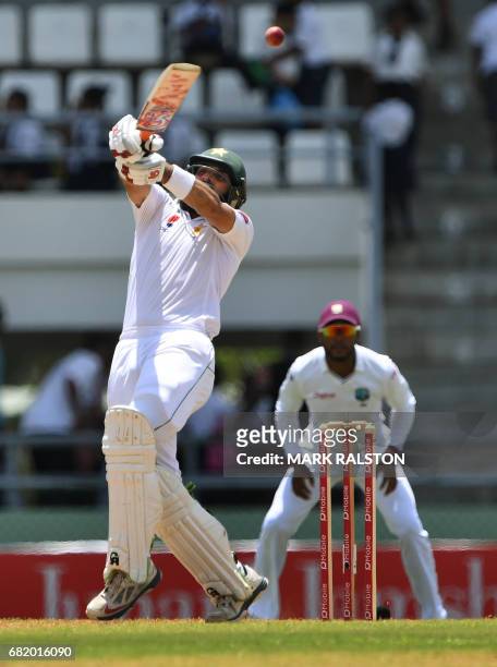 Captain Misbah-ul-Haq of Pakistan reaches for a bouncer before eventually getting out for 59 off the bowling of Chase during his final test match, on...
