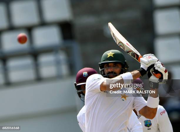 Captain Misbah-ul-Haq of Pakistan watches his shot before eventually getting out for 59 off the bowling of Chase during his final test match, on the...