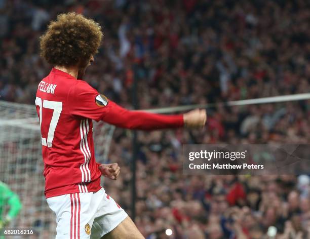 Marouane Fellaini of Manchester United celebrates scoring their first goal during the UEFA Europa League, semi final second leg match, between...