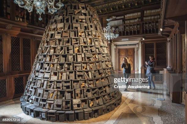 Visitors attend at the Cuban pavilion, presenting the project 'Tiempos de la intuición.' by Abel Barroso, Iván Capote, Roberto Diago, Roberto Fabelo,...